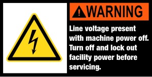 Maschinenschild mit Warnzeichen - Line voltage present with machine power off. Turon off and lock out facility power before servicing. - Aluminium